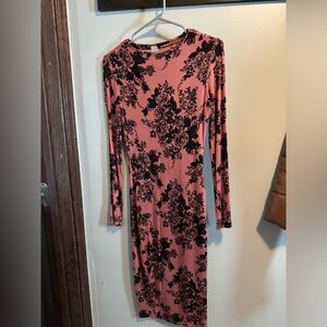 Pink and black floral dress. Has a minor snug.